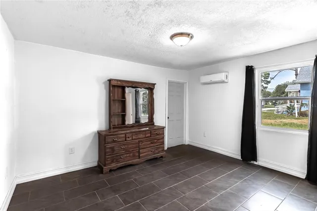a view of room with furniture and window