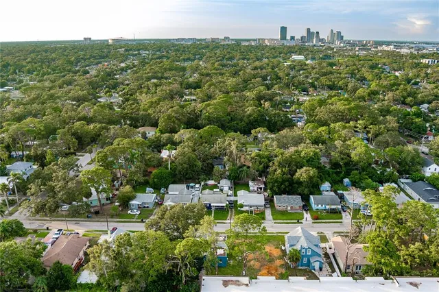 an aerial view of residential building and lake