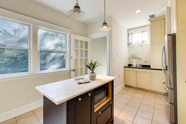 a kitchen with a sink stove and refrigerator
