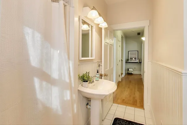 a bathroom with a sink and a mirror