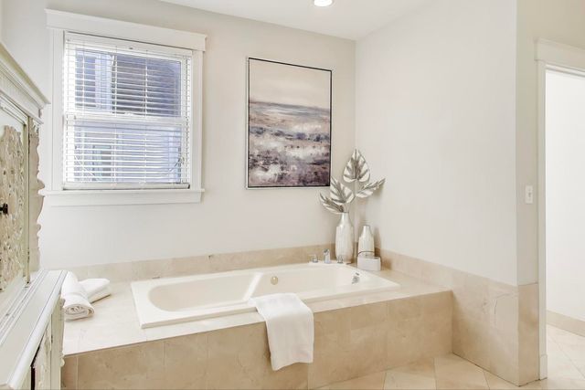 a room with walk in closet and a window