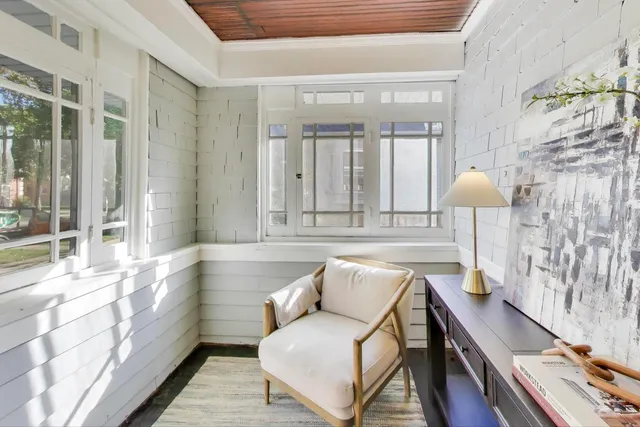 a living room with furniture and a table