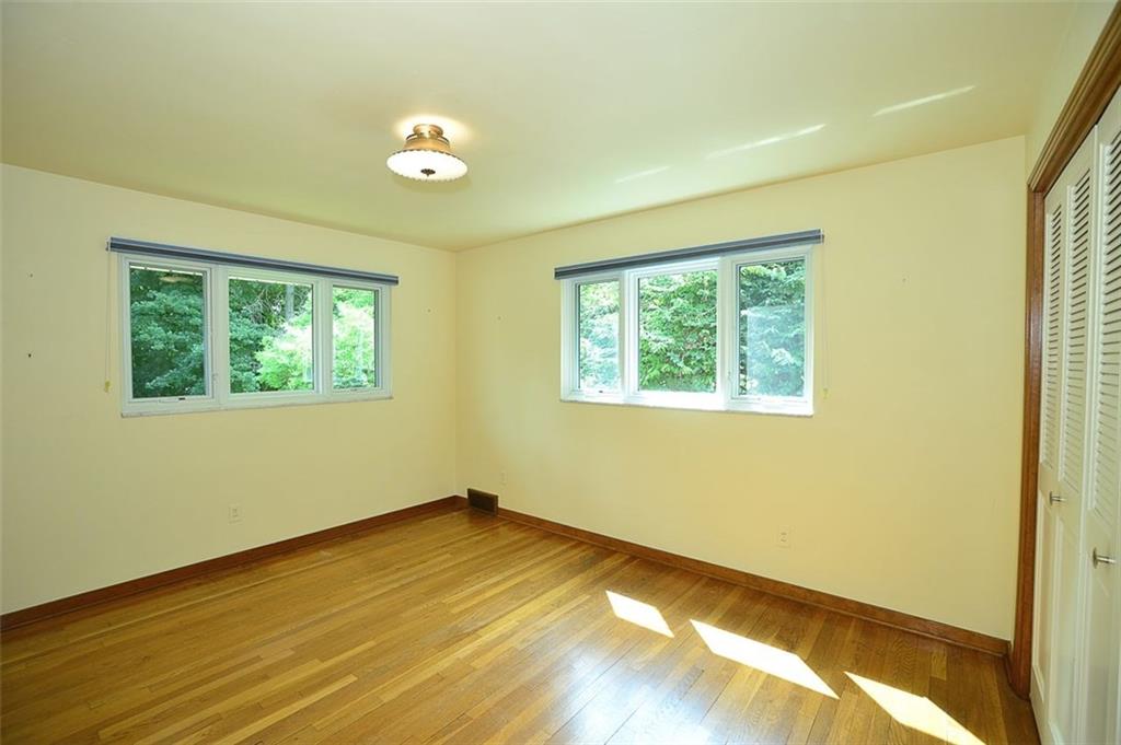 9600 Sheraton Road Pittsburgh, PA 15237 - Photo 11 of 15 Bedroom 3 with hardwood floors and Pella windows.