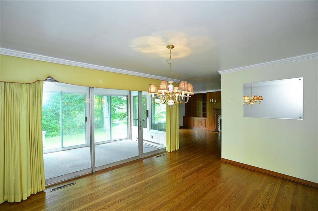9600 Sheraton Road Pittsburgh, PA 15237 - Photo 5 of 15 Formal dining room with hardwood floors and sliding doors to sun room overlooking private rear yard.