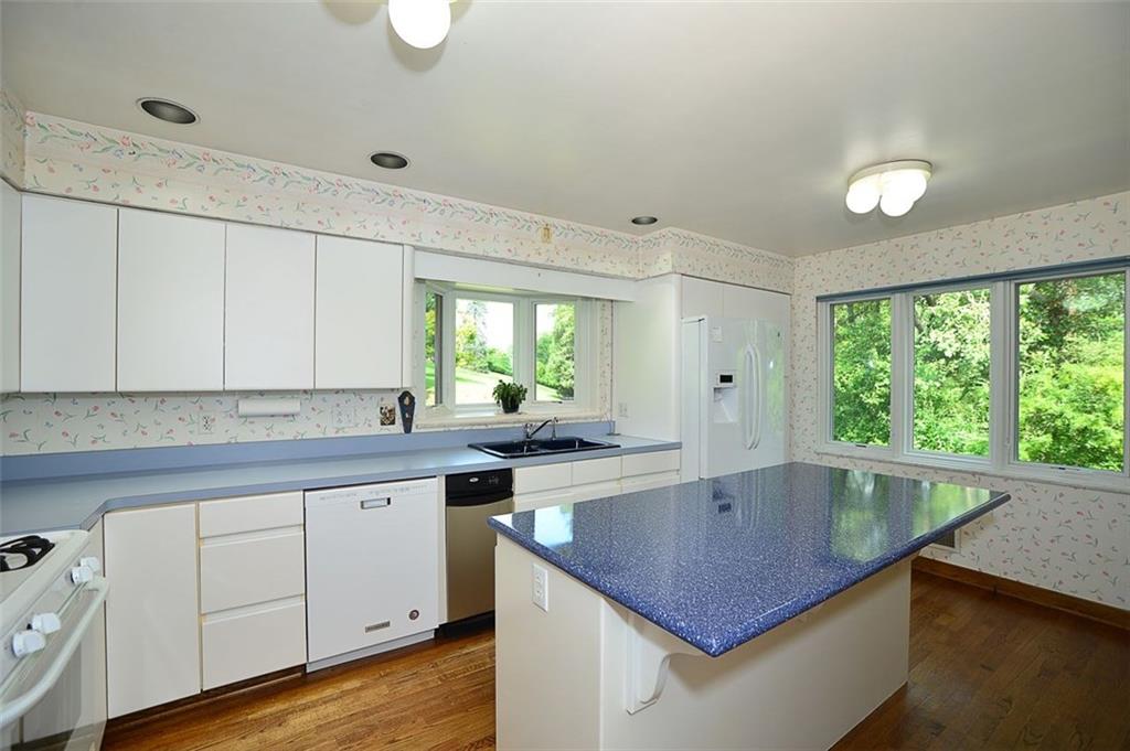 9600 Sheraton Road Pittsburgh, PA 15237 - Photo 6 of 15 Large kitchen with island, hardwood floors and newer garden window. Updated Pella windows. All appliances staying.