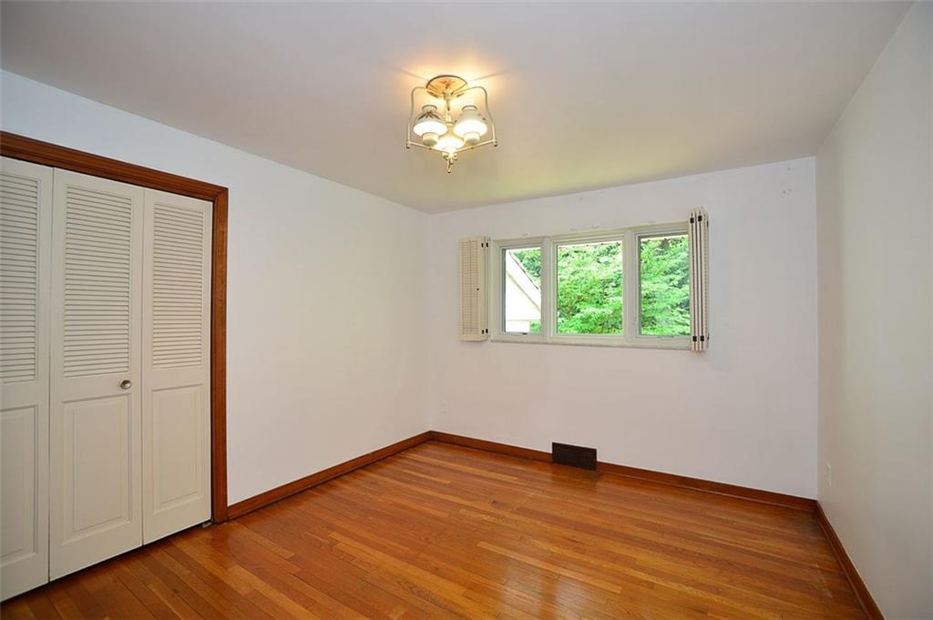 9600 Sheraton Road Pittsburgh, PA 15237 - Photo 10 of 15 Bedroom 2 with hardwood floors and Pella windows.