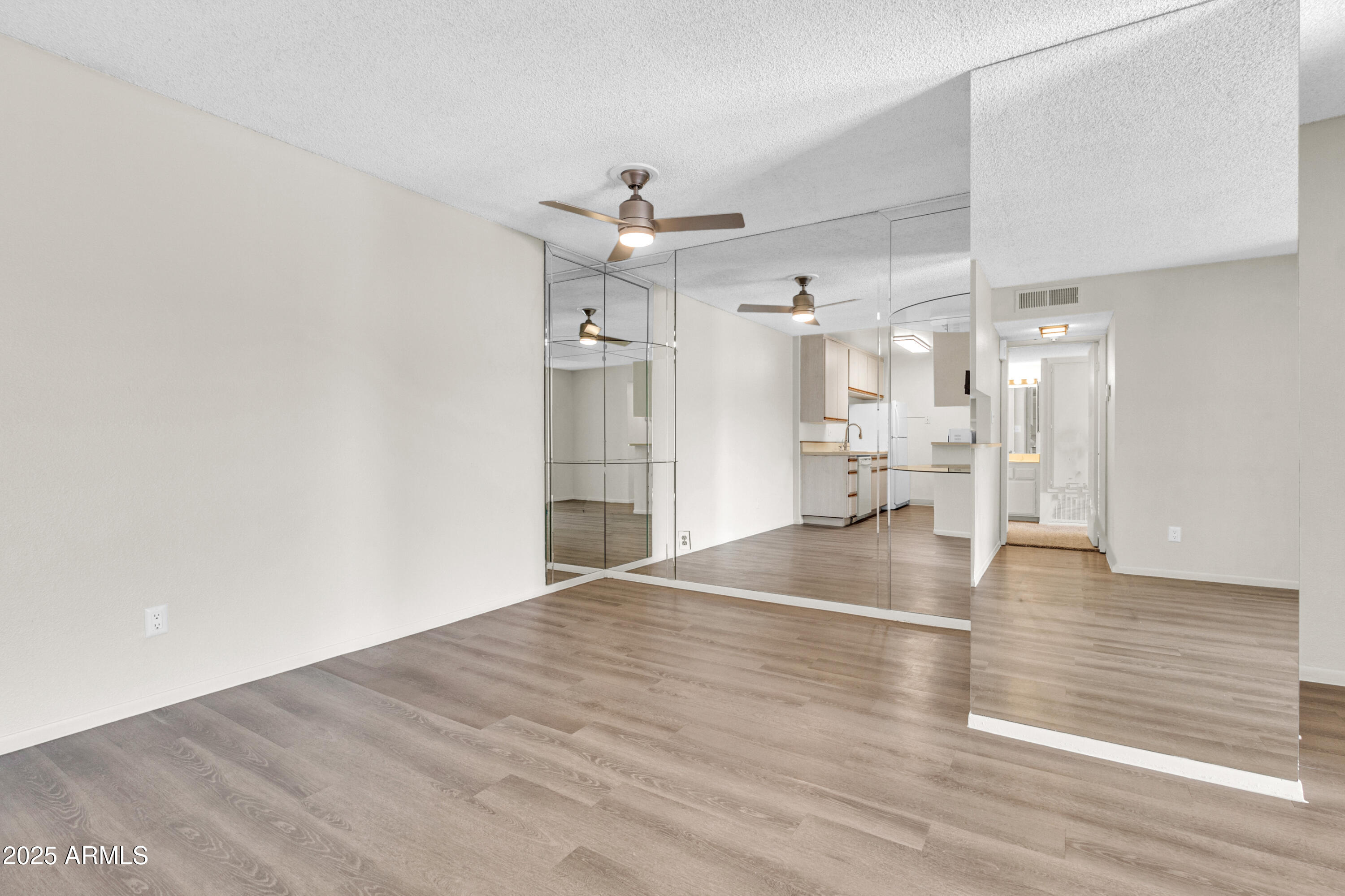 5525 East Thomas Road, Unit F9 Phoenix, AZ 85018 - Photo 16 of 48 a view of empty room with wooden floor