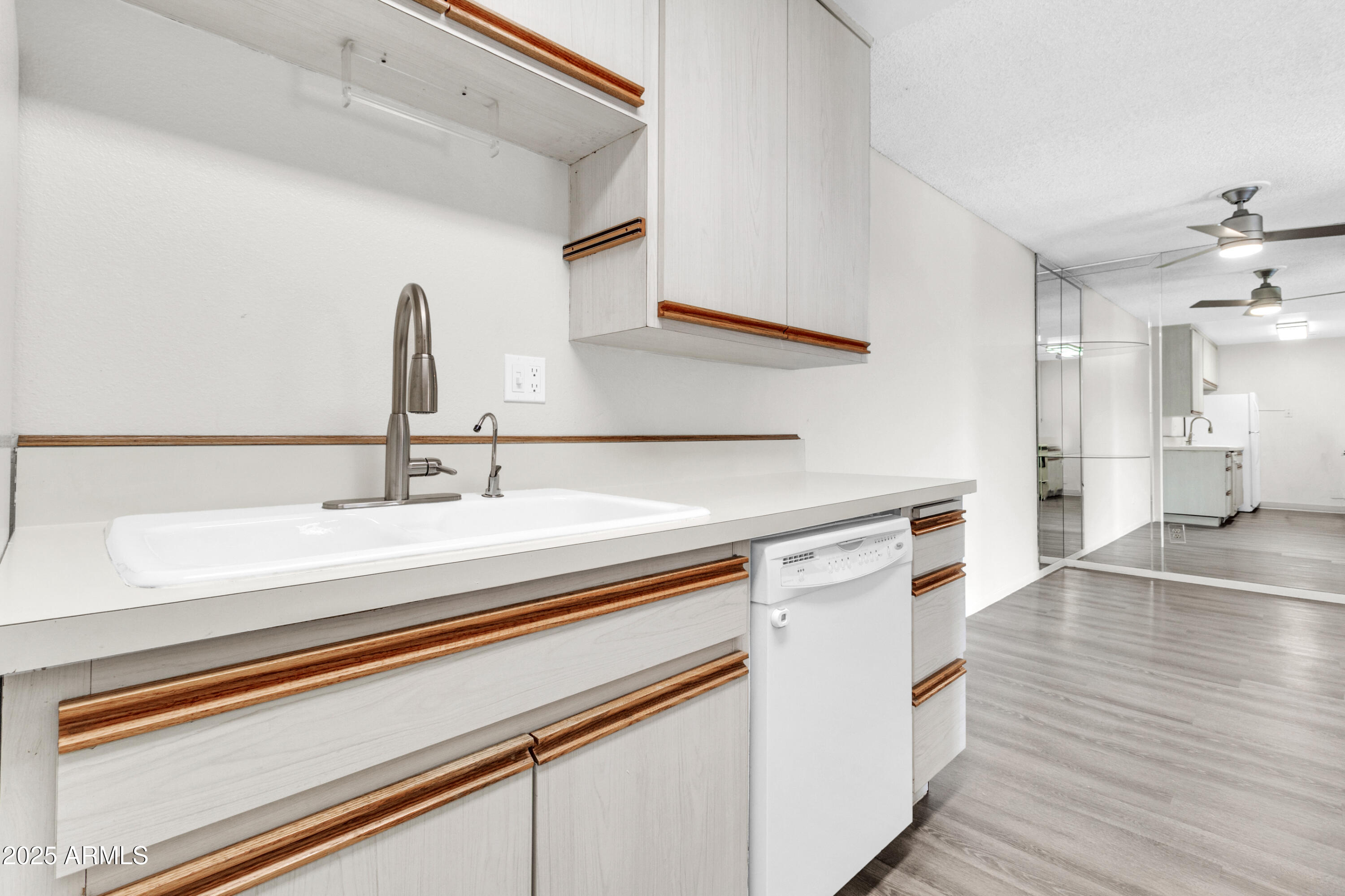 5525 East Thomas Road, Unit F9 Phoenix, AZ 85018 - Photo 25 of 48 a view with a sink and a wooden floor