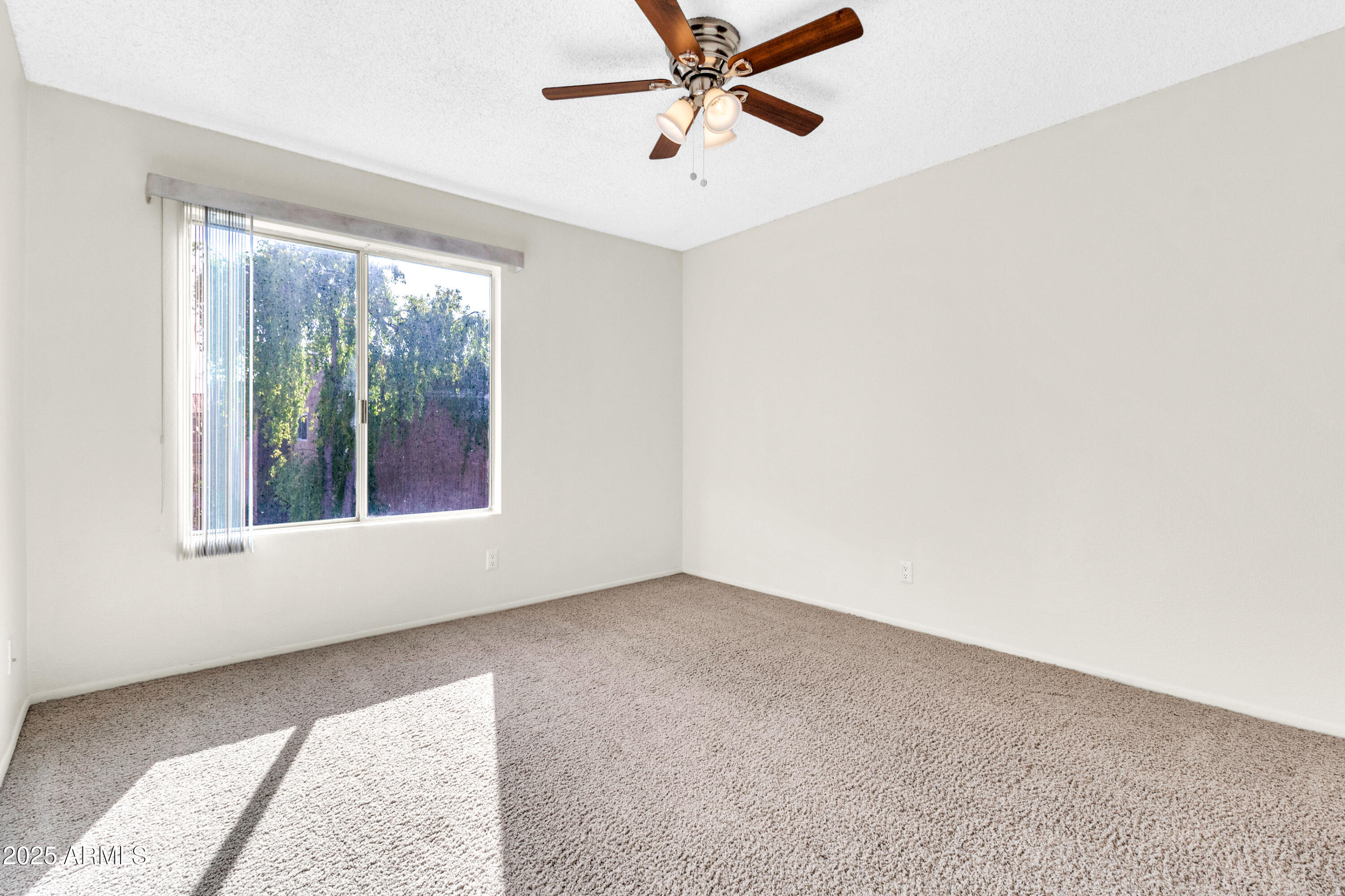 5525 East Thomas Road, Unit F9 Phoenix, AZ 85018 - Photo 36 of 48 an empty room with a window