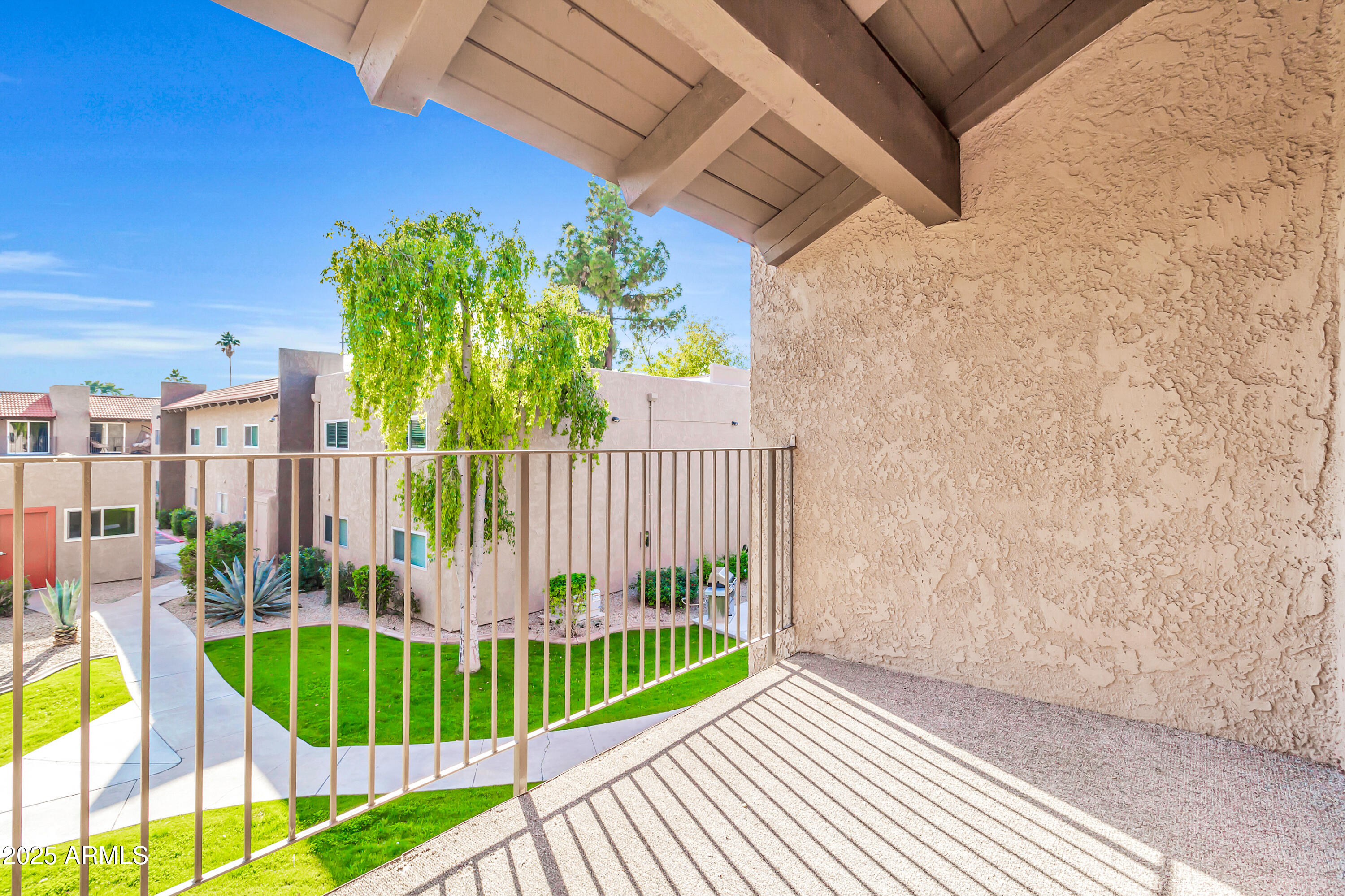 5525 East Thomas Road, Unit F9 Phoenix, AZ 85018 - Photo 43 of 48 a view of a balcony with plants