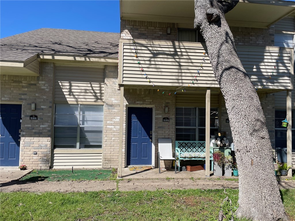 918 Spring Loop, Unit B College Station, TX 77840 - Photo 1 of 13 a view of house with backyard and outdoor seating