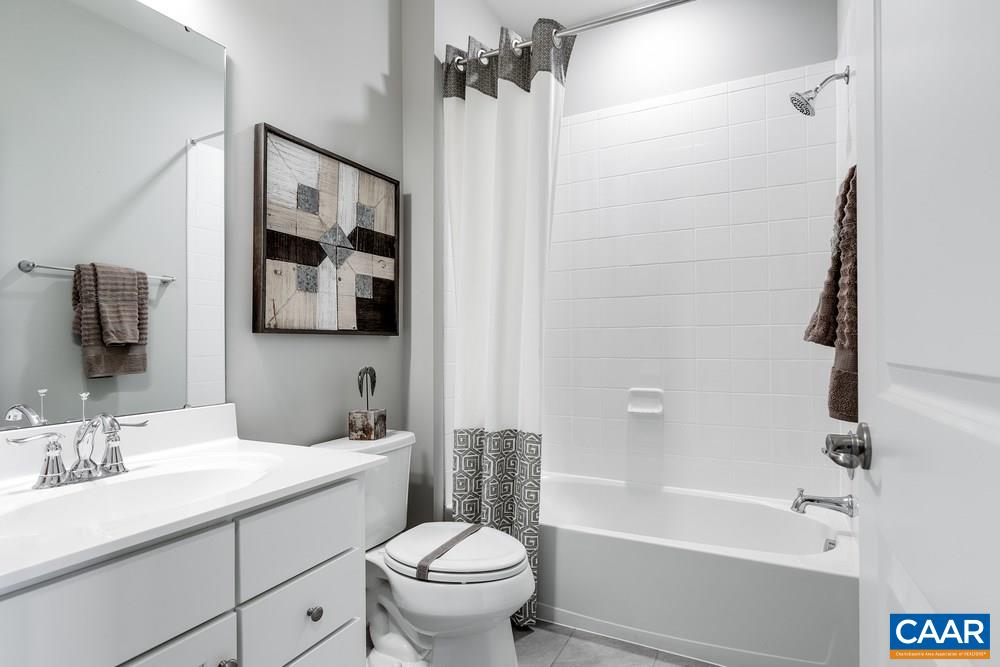 1121 Sunset Ave Extension Charlottesville, VA 22903 - Photo 12 of 20 a bathroom with a sink a toilet and shower