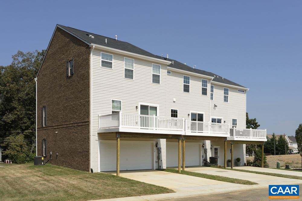 1121 Sunset Ave Extension Charlottesville, VA 22903 - Photo 13 of 20 a front view of a building with a garden