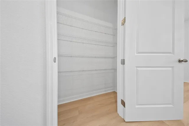 a kitchen with stainless steel appliances a refrigerator sink and microwave