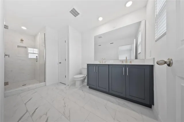 a view of an empty room and a window