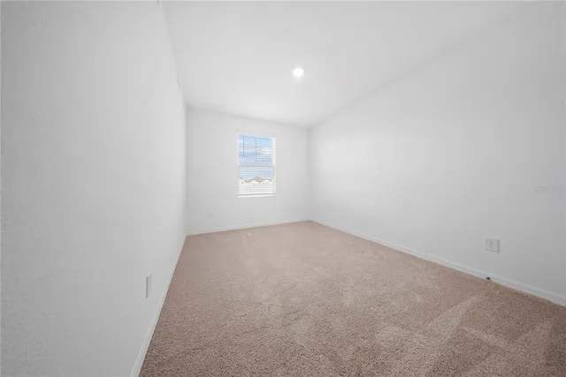 a balcony with table and chairs