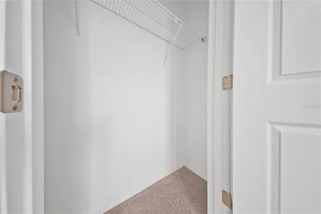 a view of a lake with houses in the back