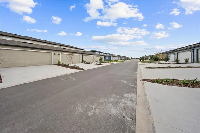 an aerial view of a house with swimming pool and outdoor space