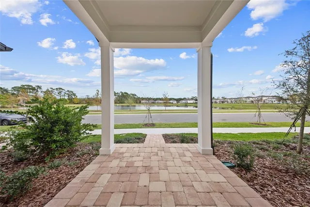 an aerial view of a house with swimming pool and outdoor space