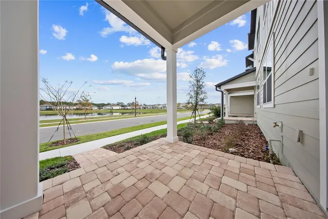 a view of a yard with an outdoor seating