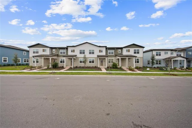 a view of a swimming pool with a yard