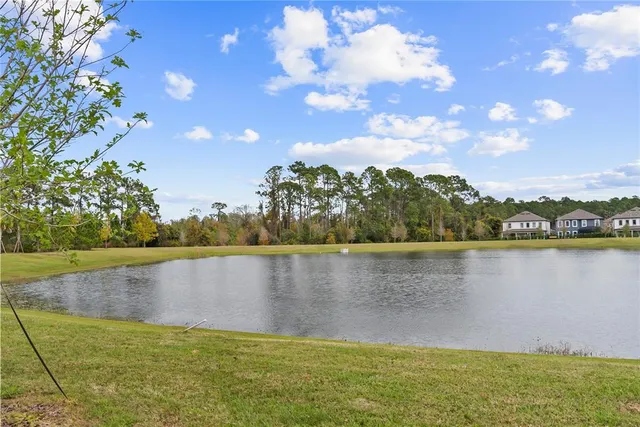 a front view of a house with a lake view