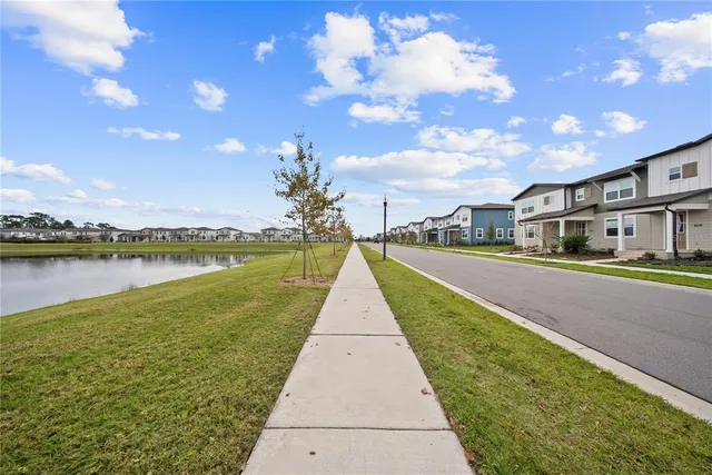 a view of a swimming pool with a lake view