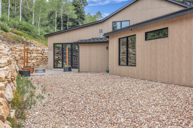1766 West Tollgate Cyn Road Coalville, UT 84017 - Photo 42 of 59 Modern exterior with light wood-finish siding and dark trim