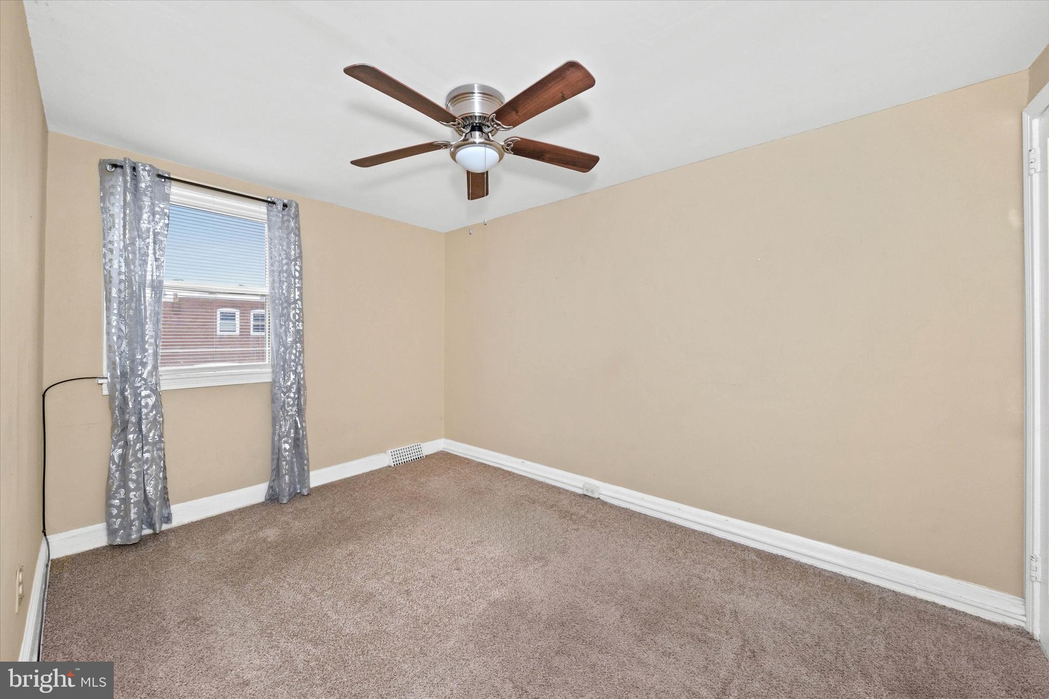 1950 Prospect Road Wilmington, DE 19805 - Photo 18 of 27 an empty room with a ceiling fan and a window