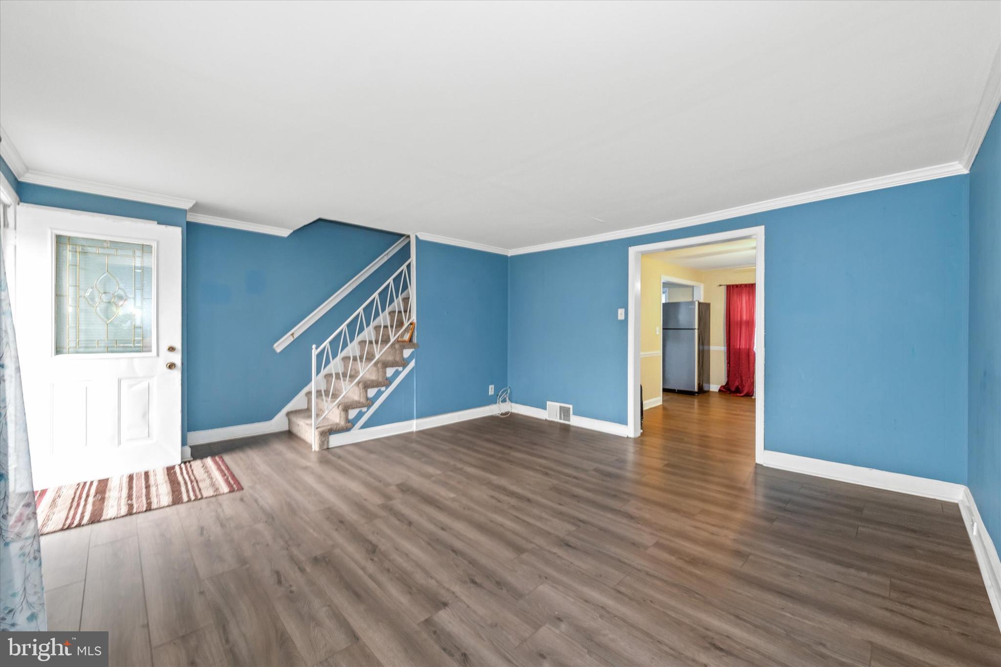 1950 Prospect Road Wilmington, DE 19805 - Photo 5 of 27 a view of an empty room with wooden floor and a window