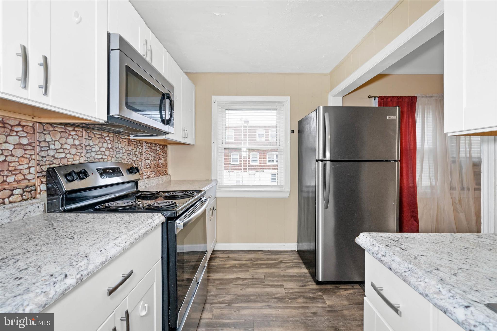 1950 Prospect Road Wilmington, DE 19805 - Photo 10 of 27 a kitchen with granite countertop a refrigerator stove and sink