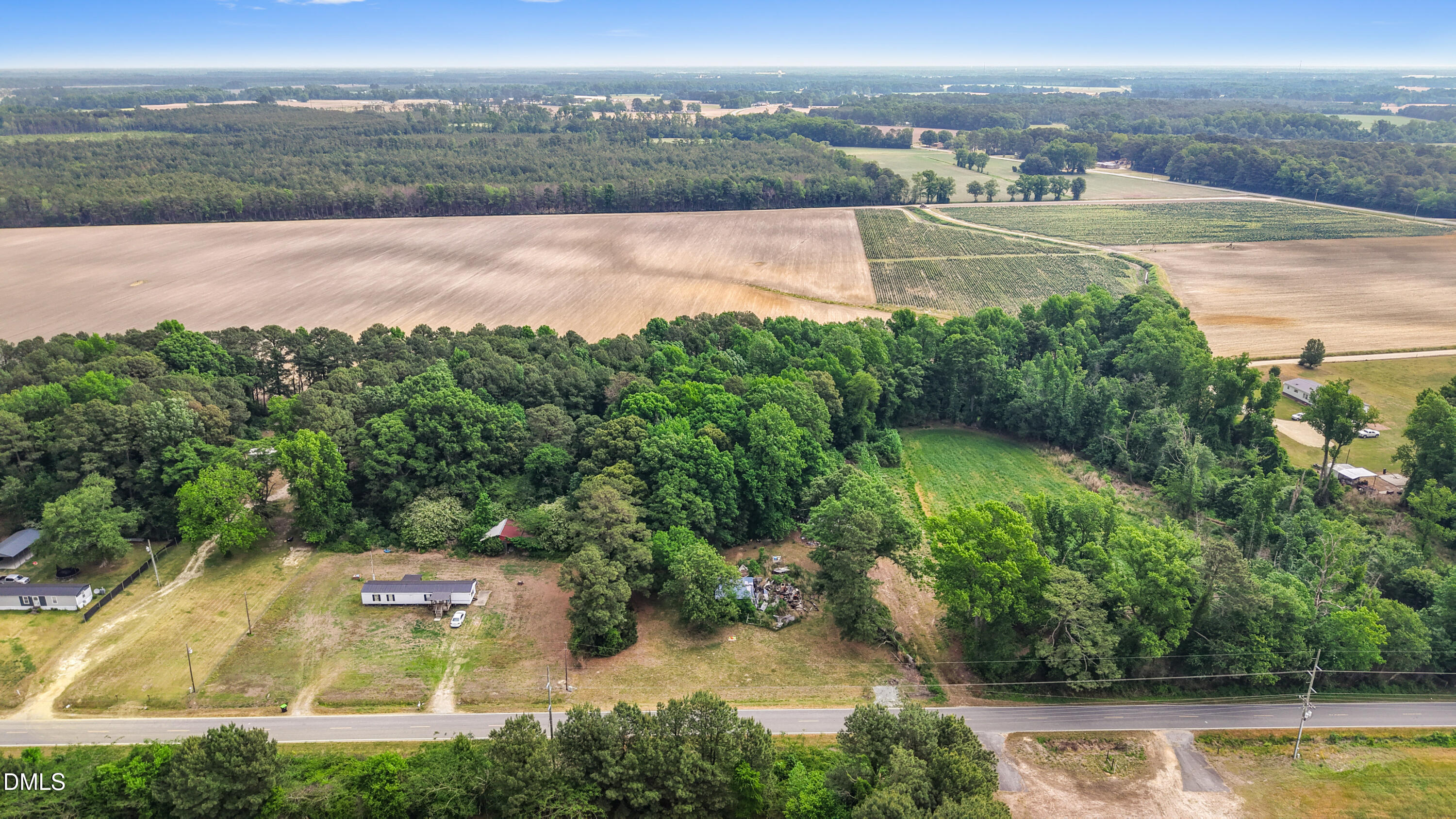 3237 East Darden Road Faison, NC 28341 - Photo 4 of 9 an aerial view of residential houses with outdoor space and lake view