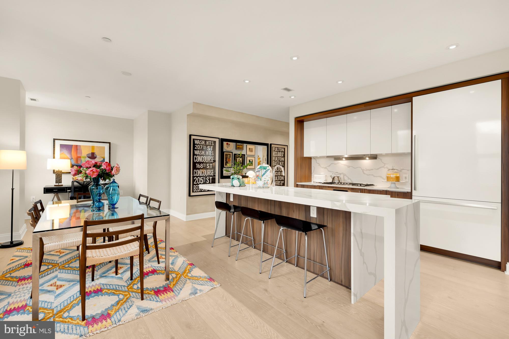 1427 Rhode Island Avenue Northwest, Unit 404 Washington, DC 20005 - Photo 12 of 35 a kitchen with stainless steel appliances granite countertop a refrigerator and a stove top oven