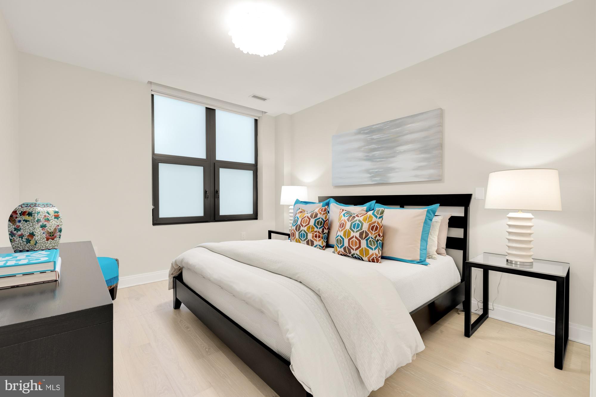 1427 Rhode Island Avenue Northwest, Unit 404 Washington, DC 20005 - Photo 18 of 35 a bedroom with a bed and window