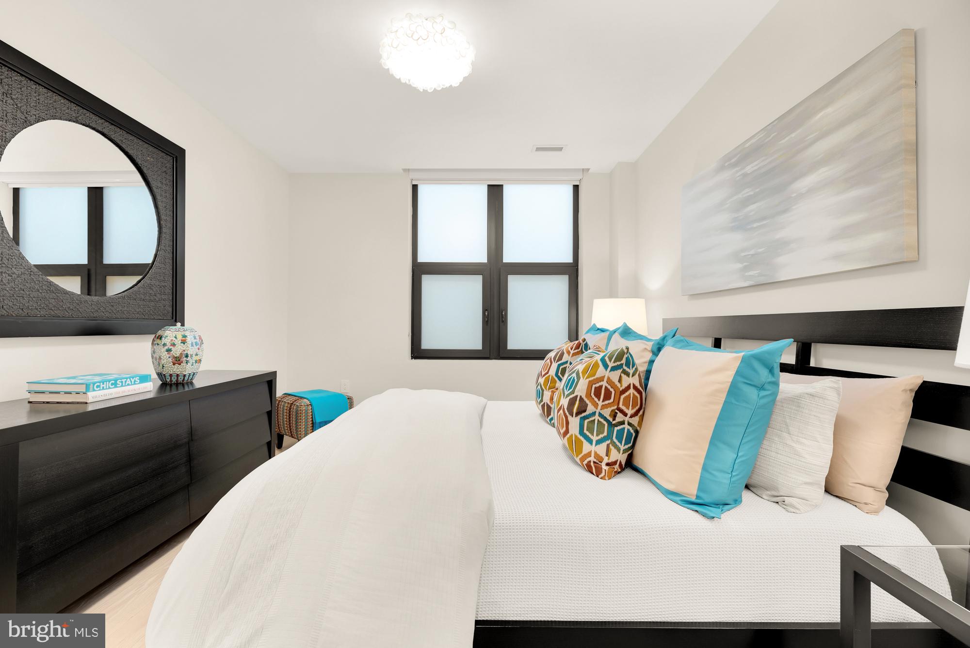 1427 Rhode Island Avenue Northwest, Unit 404 Washington, DC 20005 - Photo 19 of 35 a bedroom with a bed and window