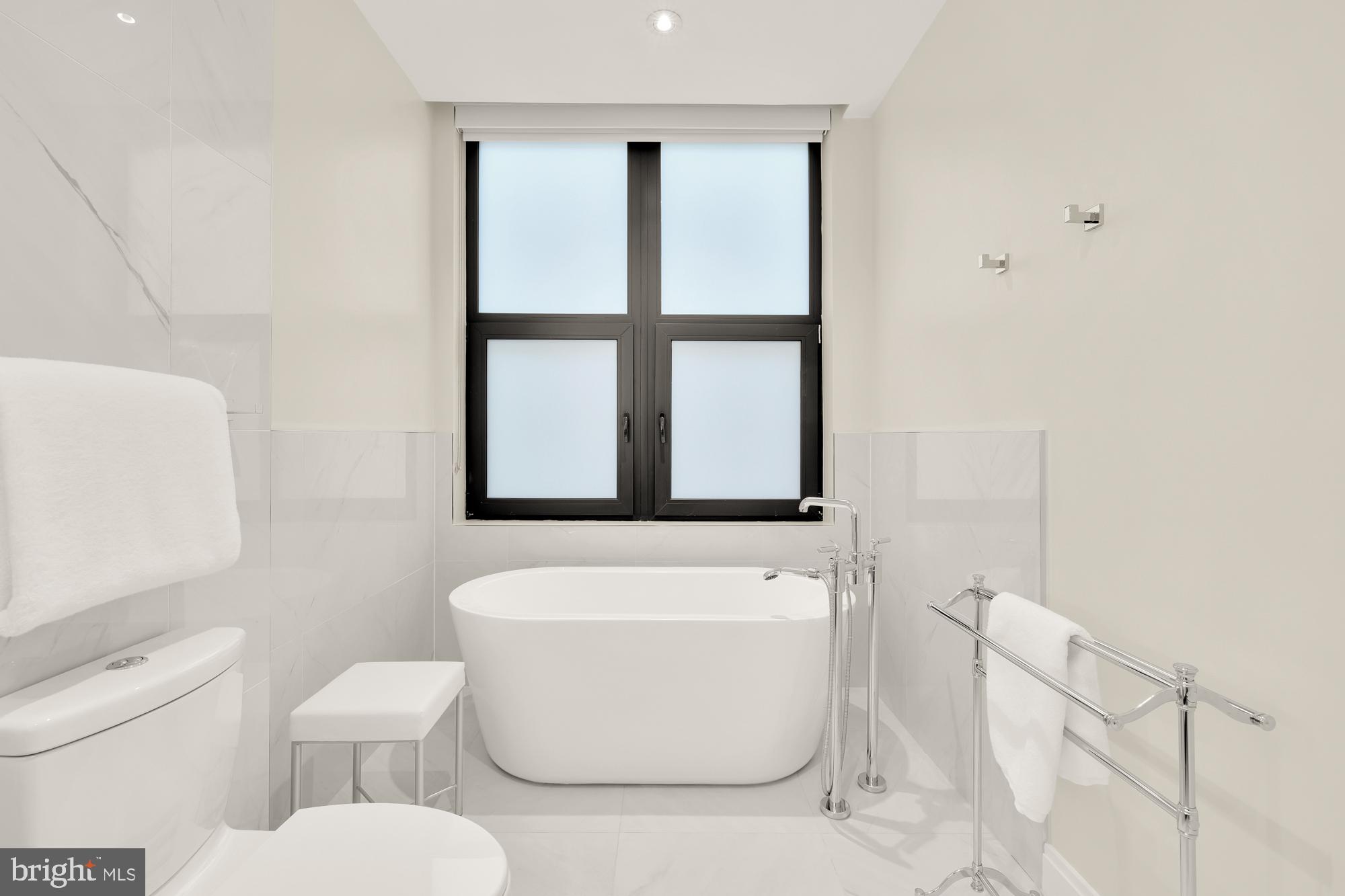 1427 Rhode Island Avenue Northwest, Unit 404 Washington, DC 20005 - Photo 23 of 35 a white toilet sitting next to a bathroom sink