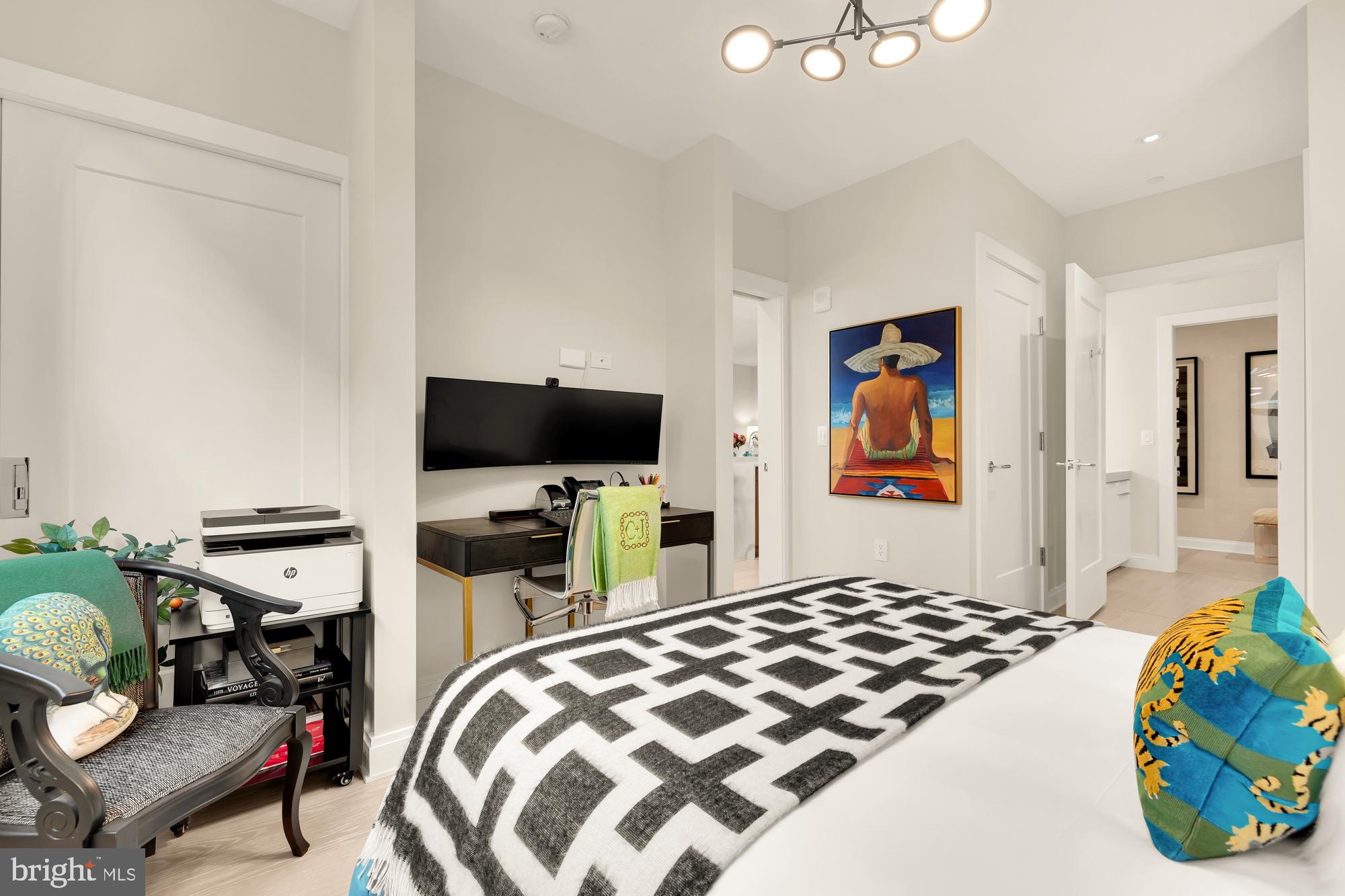 1427 Rhode Island Avenue Northwest, Unit 404 Washington, DC 20005 - Photo 24 of 35 a bedroom with a bed and flat screen tv