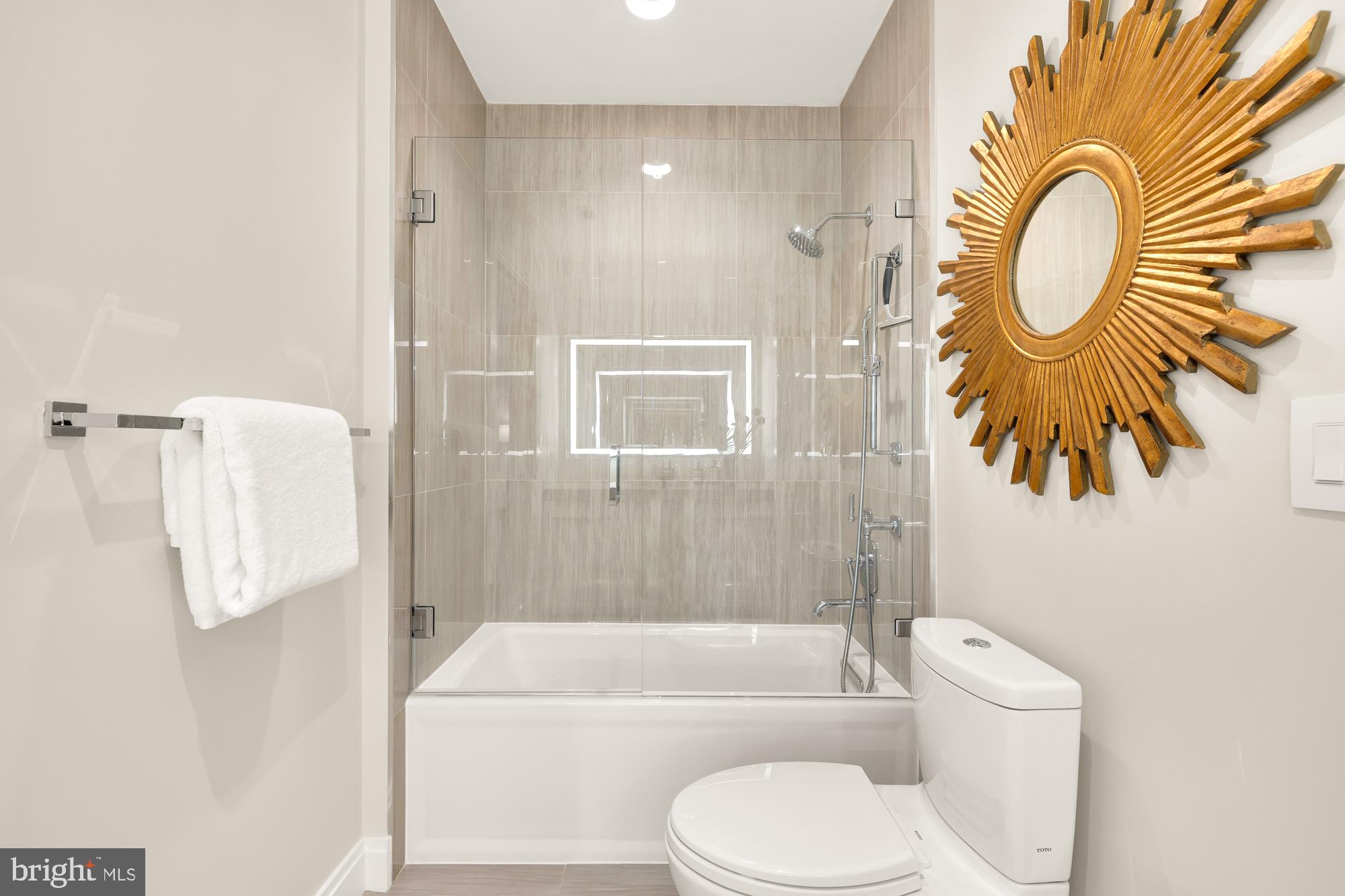 1427 Rhode Island Avenue Northwest, Unit 404 Washington, DC 20005 - Photo 27 of 35 a bathroom with a toilet sink and bathtub