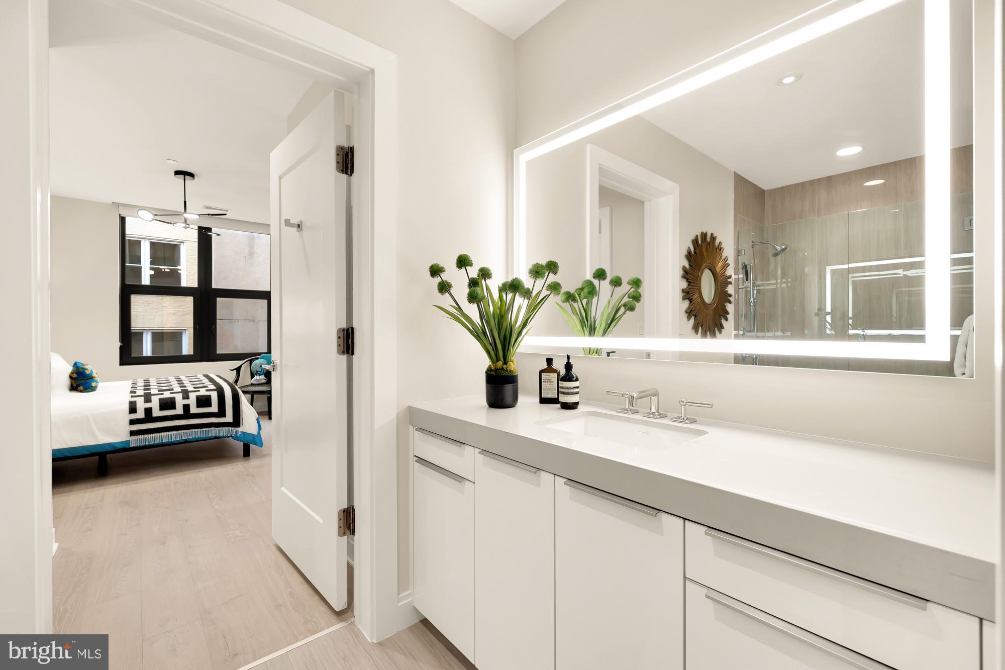 1427 Rhode Island Avenue Northwest, Unit 404 Washington, DC 20005 - Photo 28 of 35 a bathroom with sink and mirror