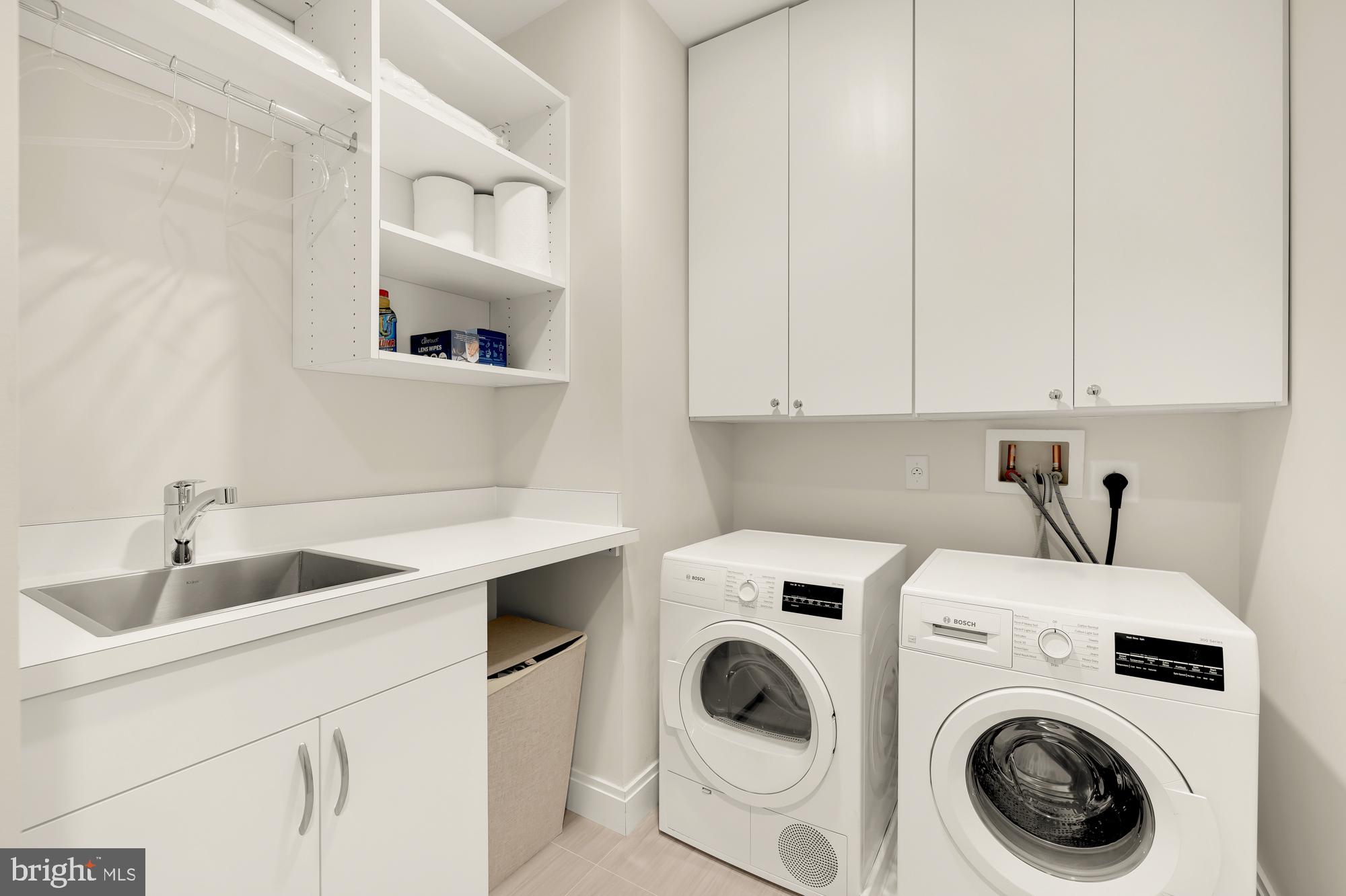 1427 Rhode Island Avenue Northwest, Unit 404 Washington, DC 20005 - Photo 29 of 35 a utility room with dryer and washer