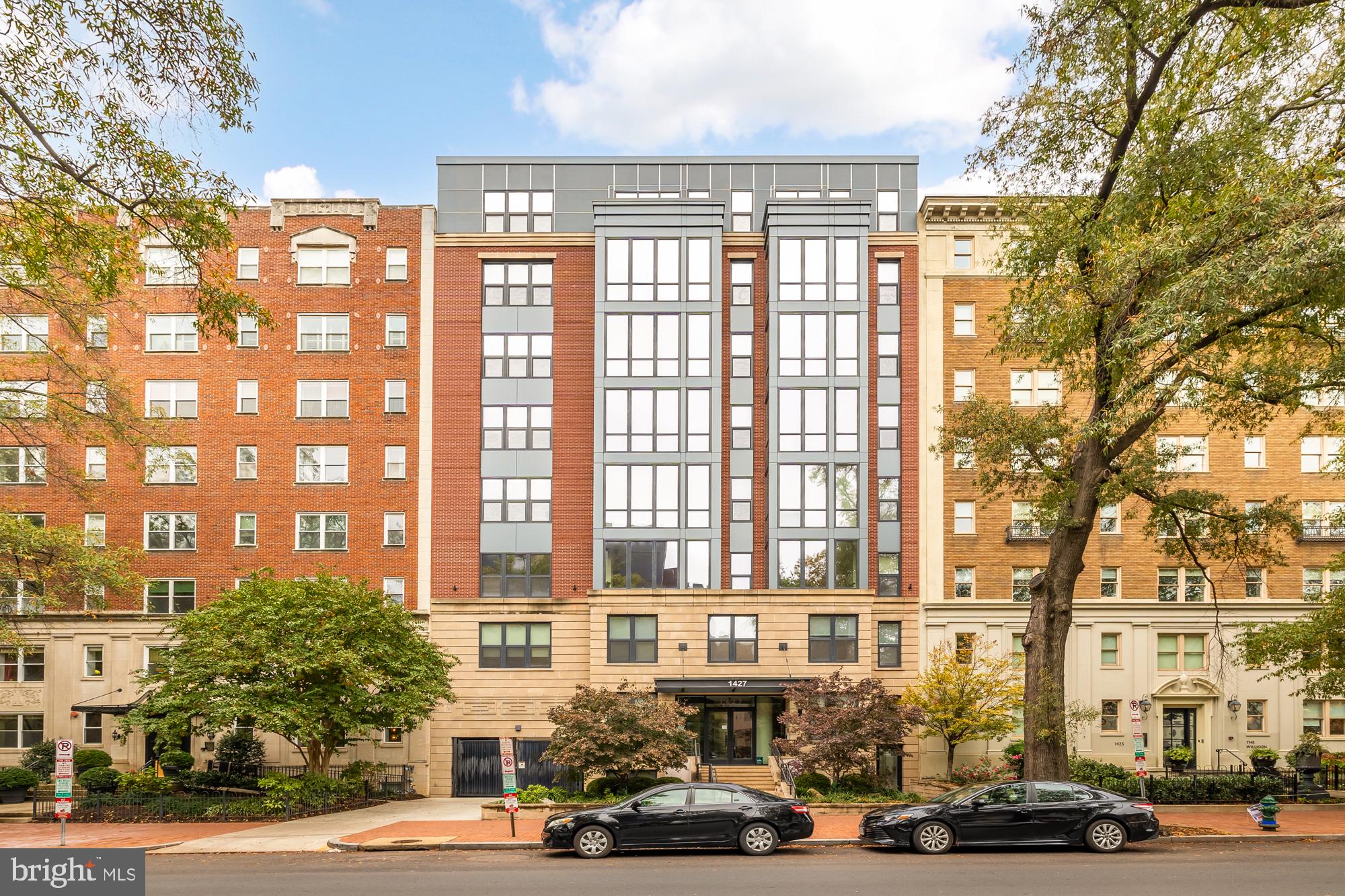 1427 Rhode Island Avenue Northwest, Unit 404 Washington, DC 20005 - Photo 33 of 35 a city street lined with tall buildings and cars