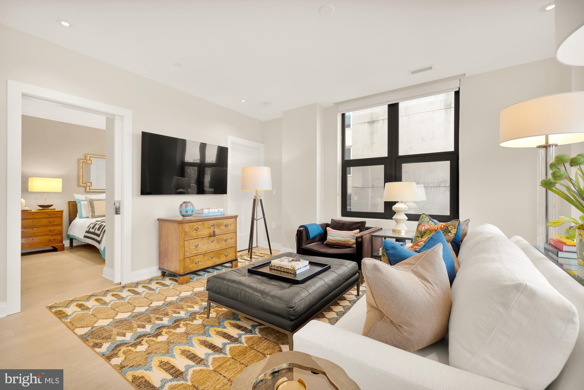 1427 Rhode Island Avenue Northwest, Unit 404 Washington, DC 20005 - Photo 6 of 35 a living room with furniture and a flat screen tv