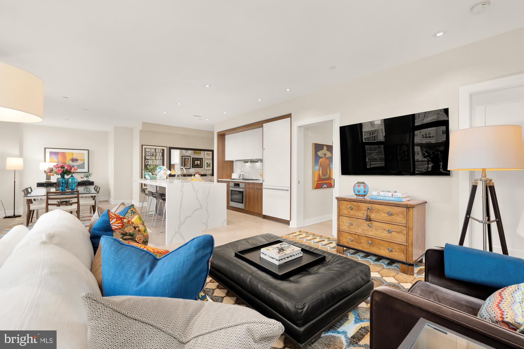 1427 Rhode Island Avenue Northwest, Unit 404 Washington, DC 20005 - Photo 7 of 35 a living room with furniture and a flat screen tv