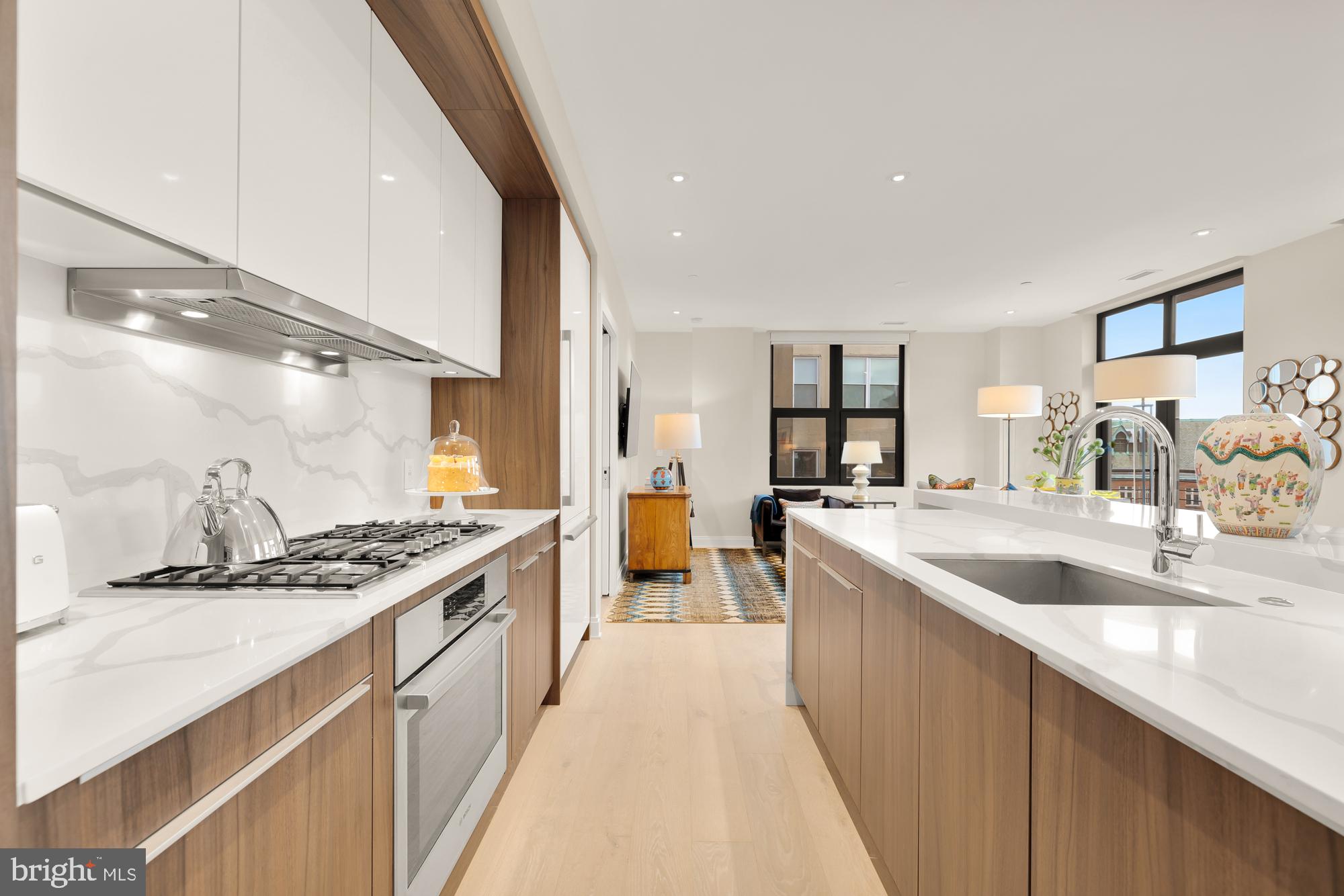 1427 Rhode Island Avenue Northwest, Unit 404 Washington, DC 20005 - Photo 10 of 35 a kitchen with stainless steel appliances granite countertop a sink and cabinets