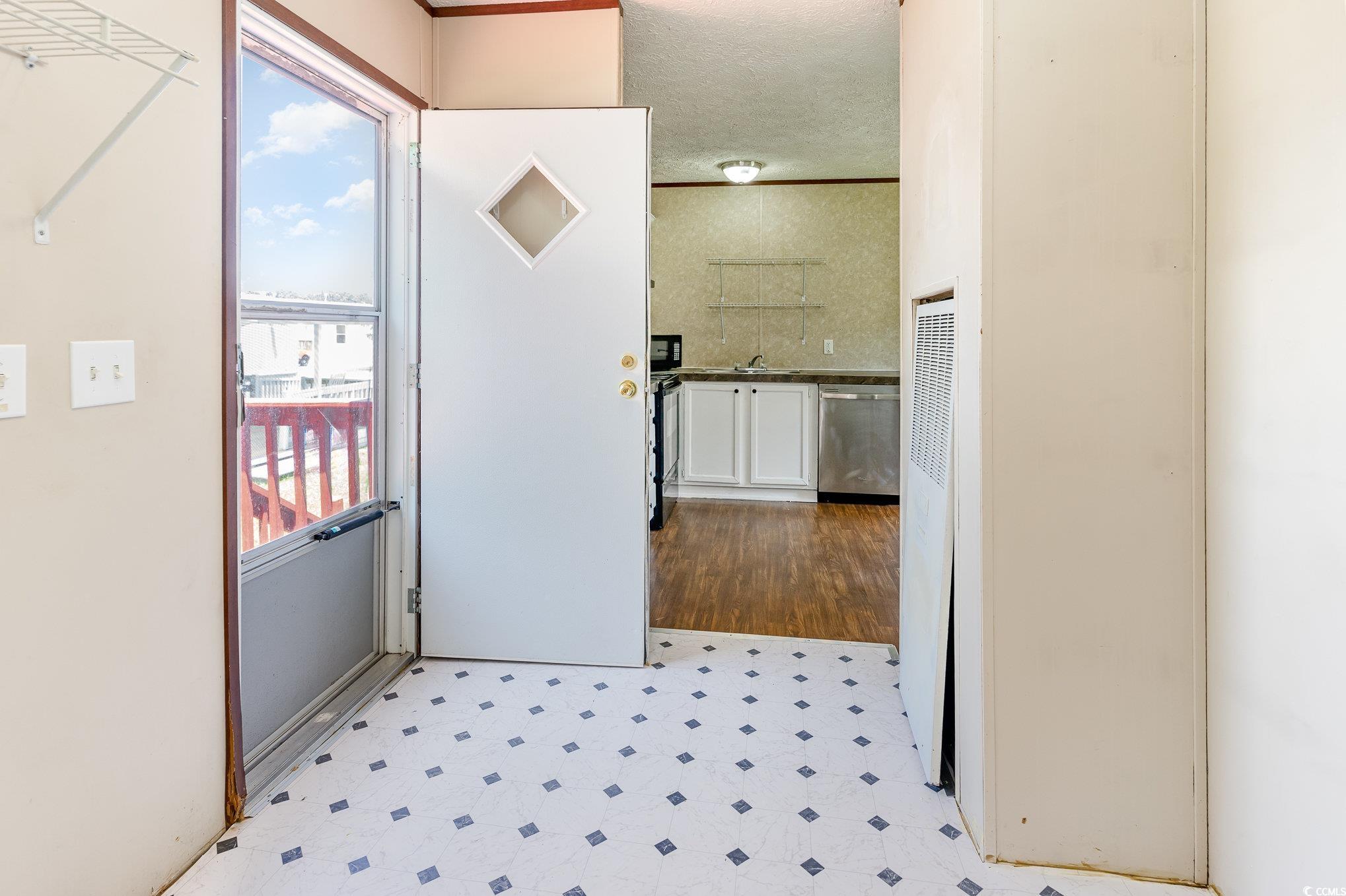 2100 Highway 15 Myrtle Beach, SC 29577 - Photo 3 of 35 Corridor with sink and light tile patterned floors