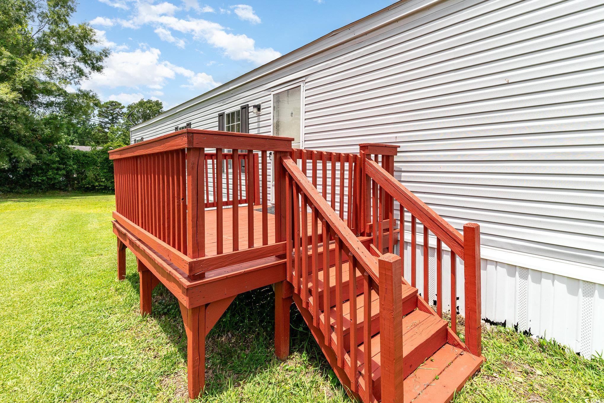 2100 Highway 15 Myrtle Beach, SC 29577 - Photo 31 of 35 Wooden terrace with a lawn