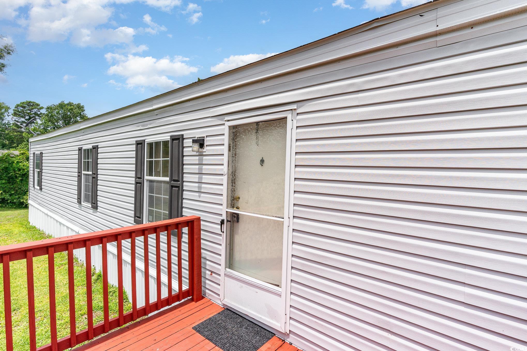 2100 Highway 15 Myrtle Beach, SC 29577 - Photo 32 of 35 View of exterior entry with a deck