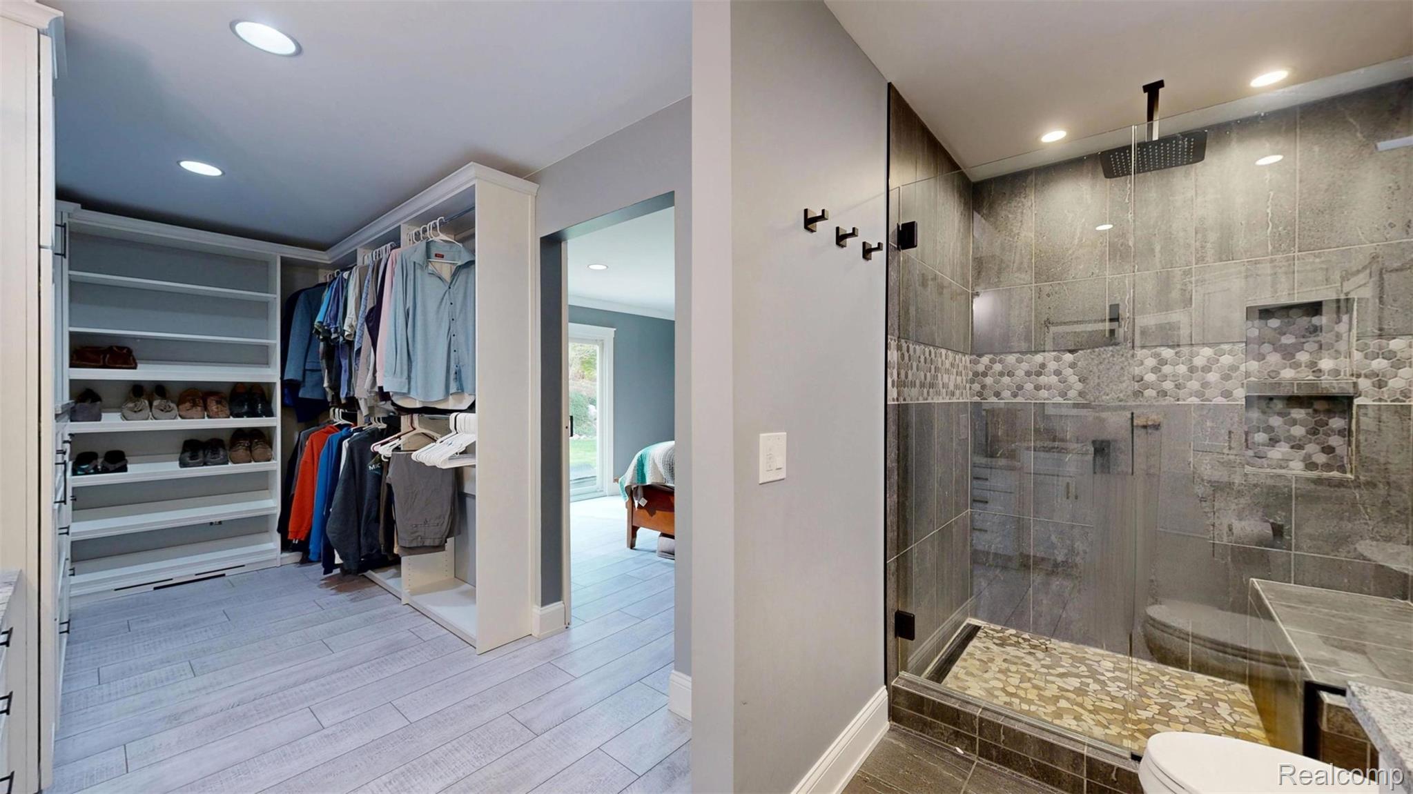 10300 Clark Road Davisburg, MI 48350 - Photo 15 of 39 Ensuite bathroom featuring a walk in closet, a stall shower, light wood-style floors, and recessed lighting