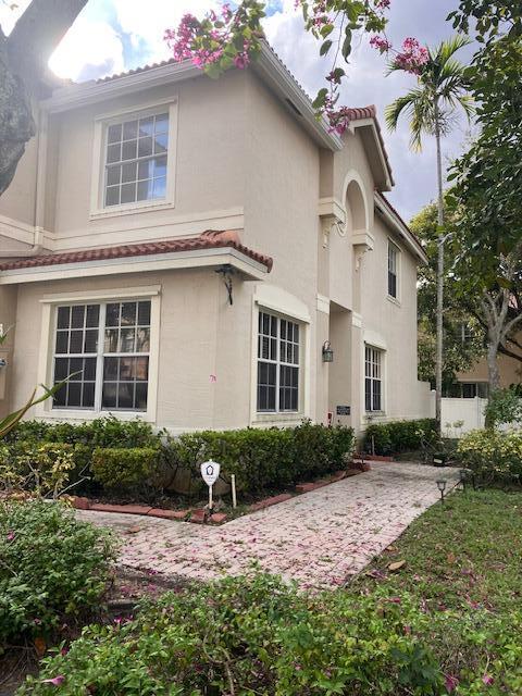 4262 Southwest 124th Way Miramar, FL 33027 - Photo 2 of 2 a front view of a house with garden and yard