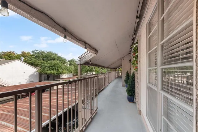 a view of a two chairs in the balcony